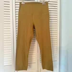 This is lululemon Align™ Super-High-Rise Crop 21" mustard color.